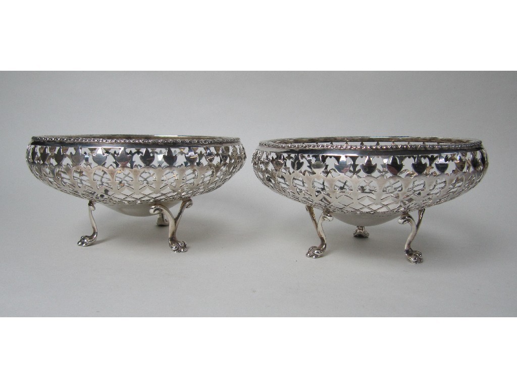 Appraisal: A pair of silver pierced bon bon dishes on paw