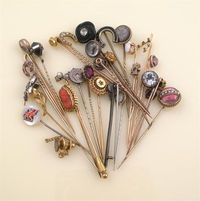 Appraisal: A collection of thirty-three stick pins including a painted fox