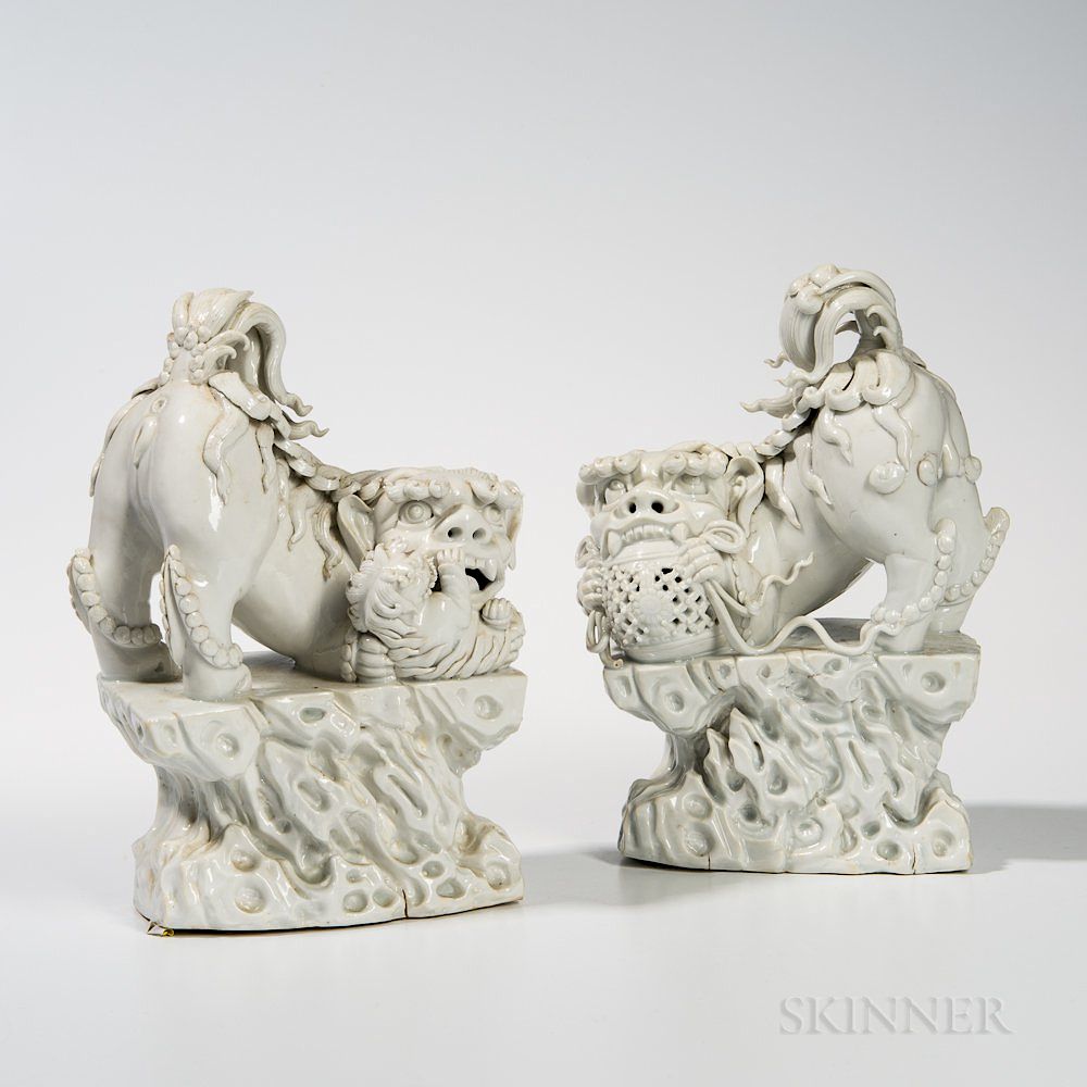 Appraisal: Pair of Blanc-de-Chine Foo Dogs Pair of Blanc-de-Chine Foo Dogs