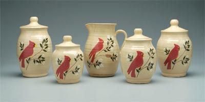 Appraisal: Anita Meaders canisters and pitcher pitcher in four graduated lidded