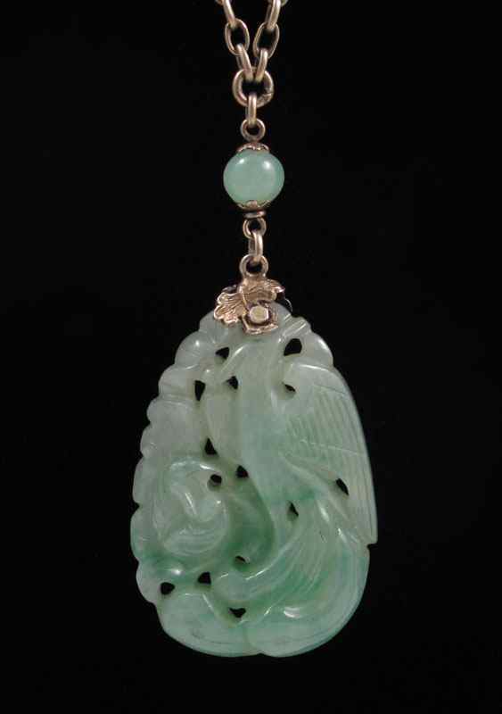 Appraisal: CARVED JADEITE JADE BIRD DESIGN PENDANT NECKLACE Hangs from an