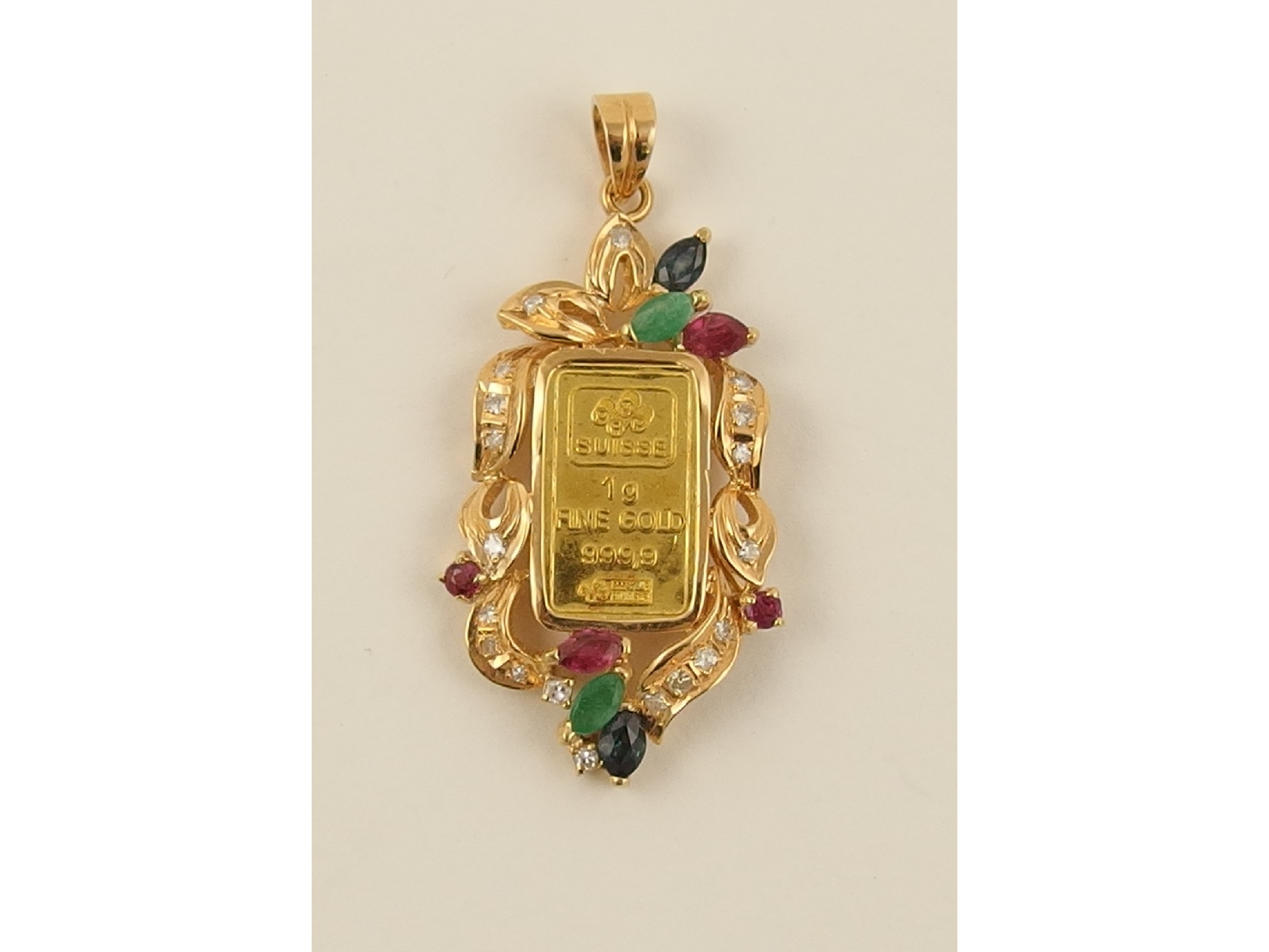 Appraisal: An ct pendant set with emeralds diamonds rubies and sapphires