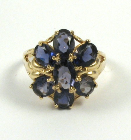 Appraisal: IOLITE AND FOURTEEN KARAT GOLD RING set with seven oval-cut