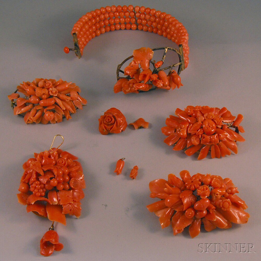 Appraisal: Group of Carved Coral Jewelry a multi-strand coral bracelet with