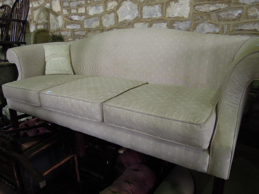 Appraisal: A Georgian style three seat camel back sofa with shaped