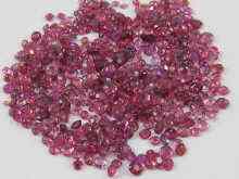 Appraisal: A quantity of loose polished natural red stones including garnets