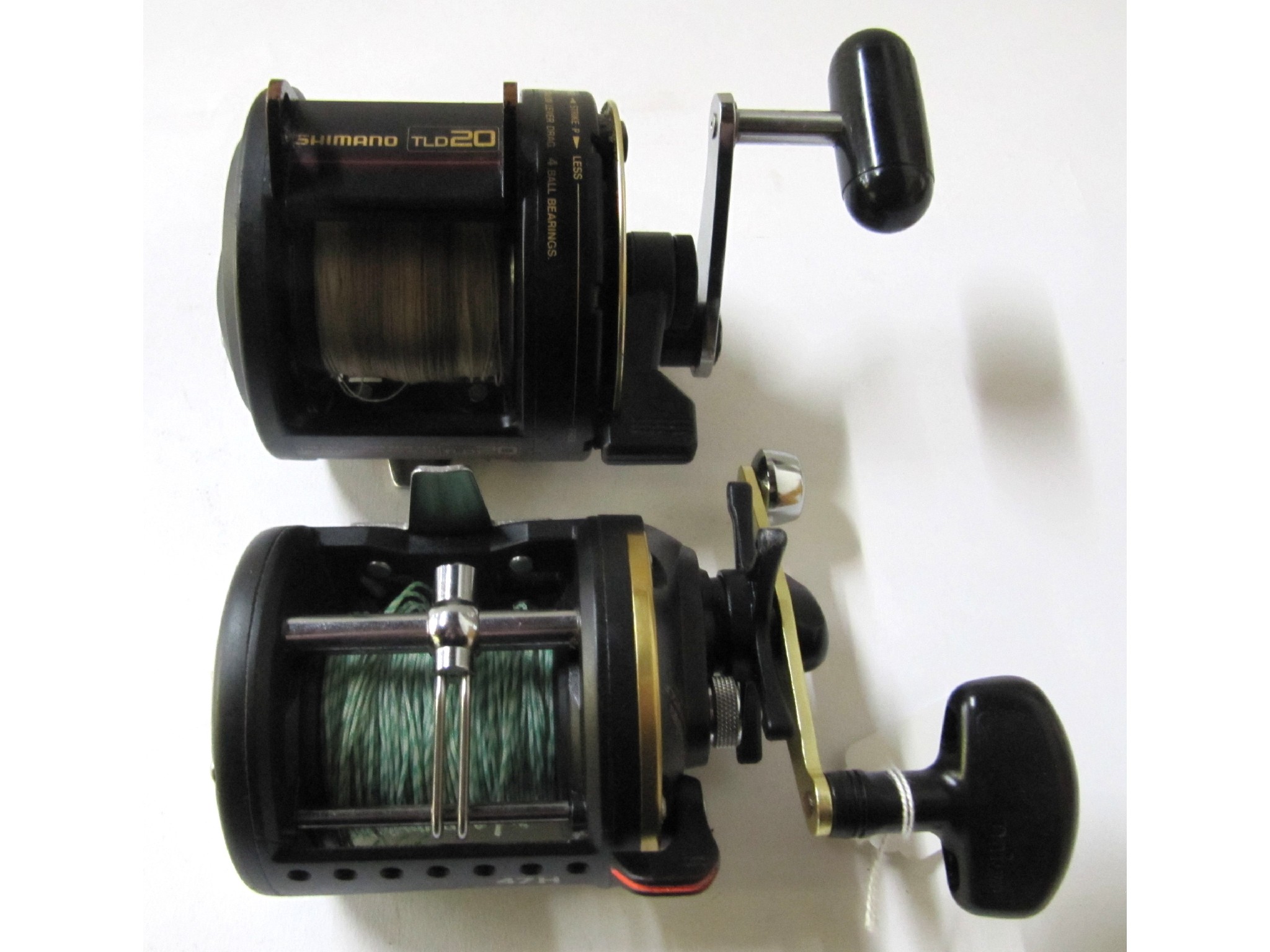 Appraisal: A lot comprising a Wilderness fishing rod and two reels