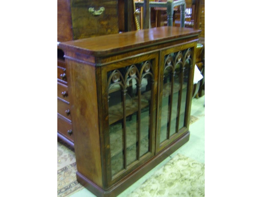 Appraisal: A Regency mahogany bookcase enclosed by a pair of glazed