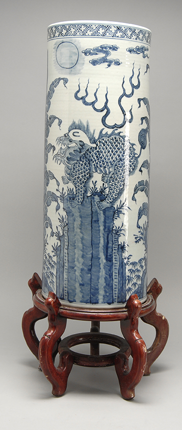 Appraisal: BLUE AND WHITE PORCELAIN UMBRELLA STAND th CenturyWith qilin landscape