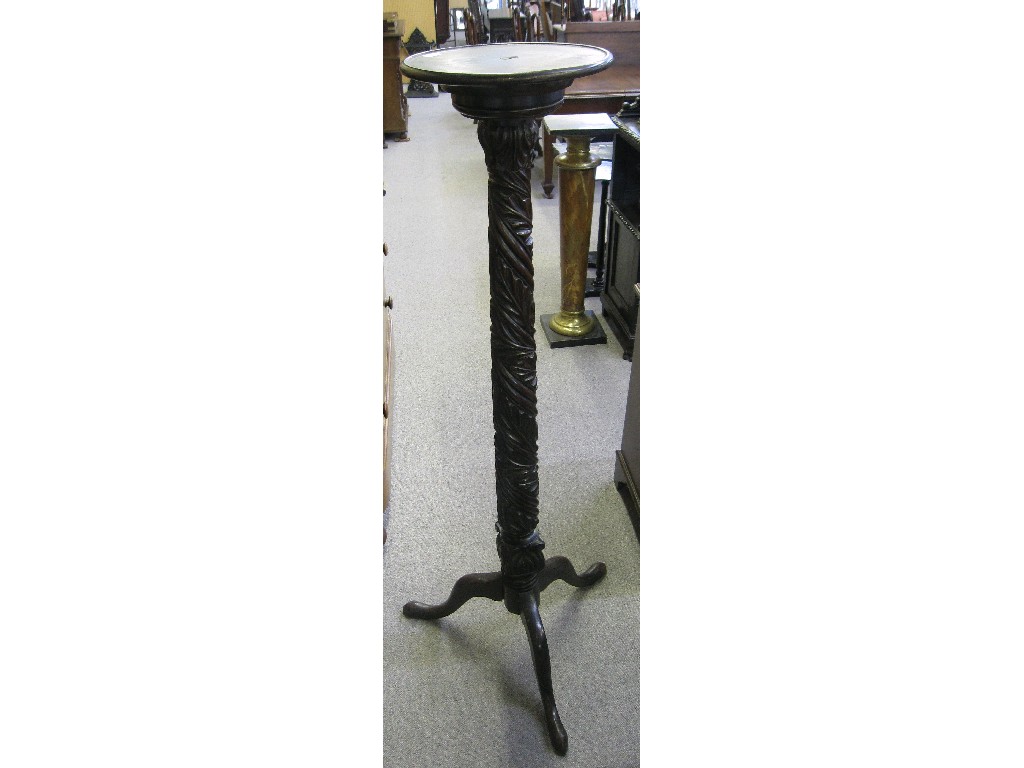 Appraisal: Mahogany torchere with ornately carved stem