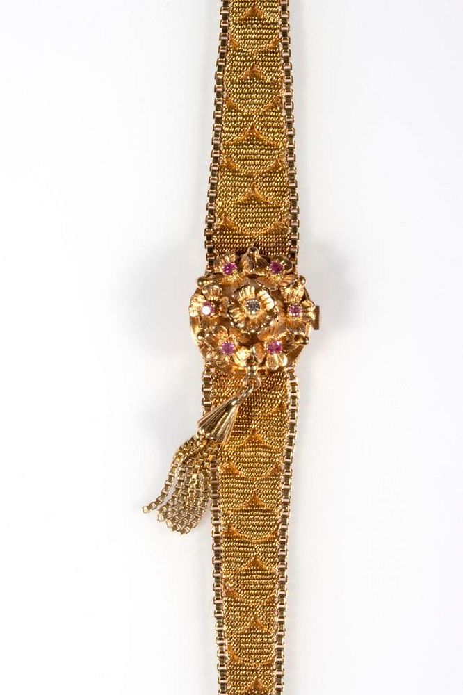 Appraisal: Ruby diamond and k gold covered wristwatch circa s the