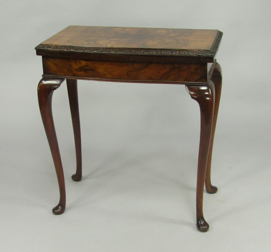 Appraisal: A walnut fold over card table thC the top with