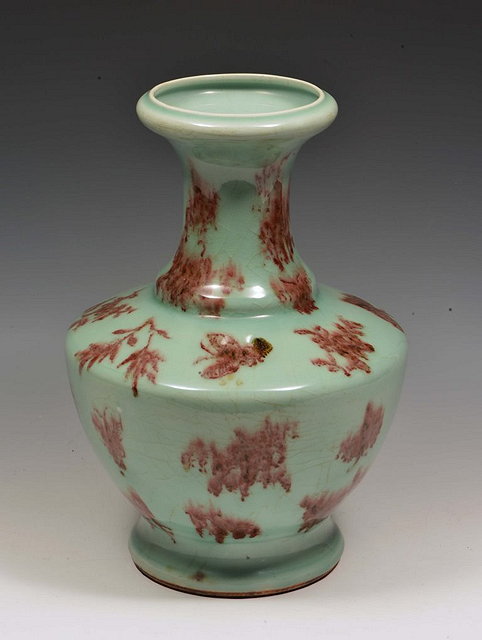 Appraisal: A CHINESE CELADON BALUSTER VASE with iron red underglaze butterfly