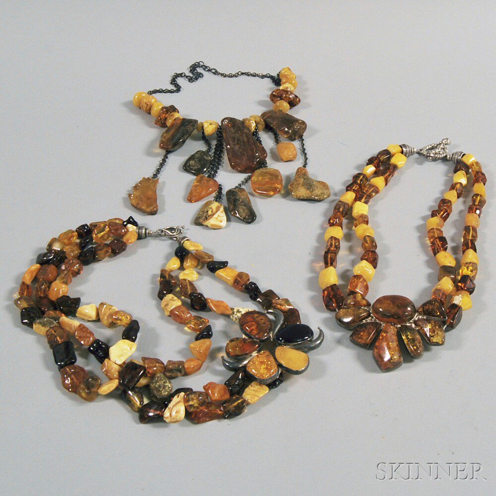 Appraisal: Three Large Amber Necklaces one fringe-style chain and stone necklace