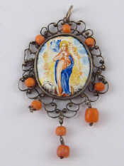 Appraisal: An antique silver and coral pendant with central enamelled miniature