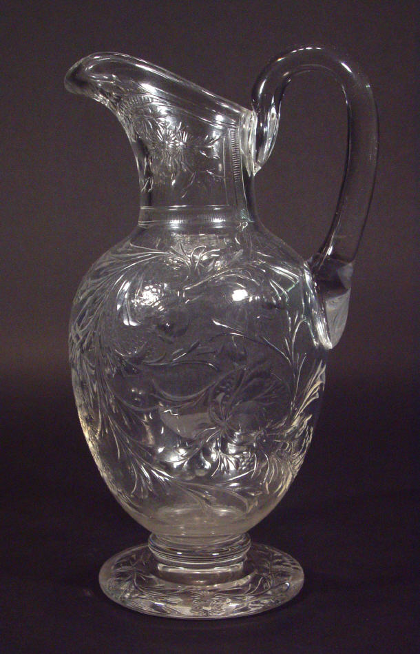 Appraisal: Rock crystal glass claret jug cut with flowers and leaves