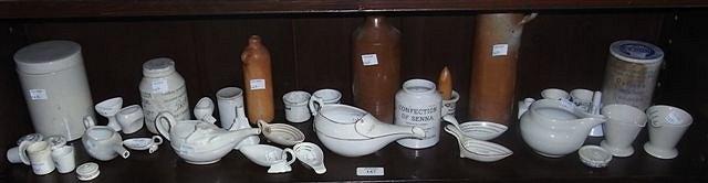 Appraisal: TWO STONEWARE BOTTLES one marked 'Carless of Stafford' an advertising