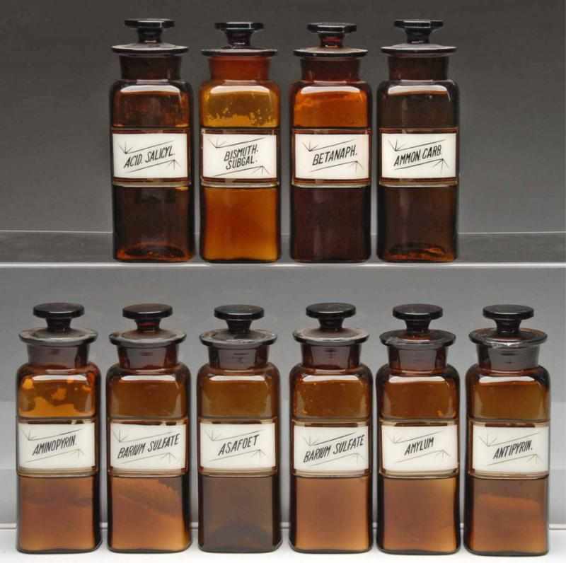 Appraisal: Lot of Amber Glass Druggist Shop Bottles Description Circa to