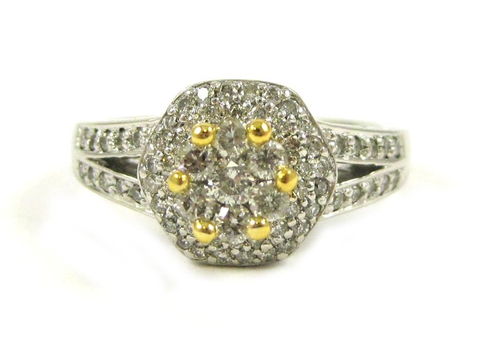 Appraisal: DIAMOND AND FOURTEEN KARAT GOLD RING The white and yellow