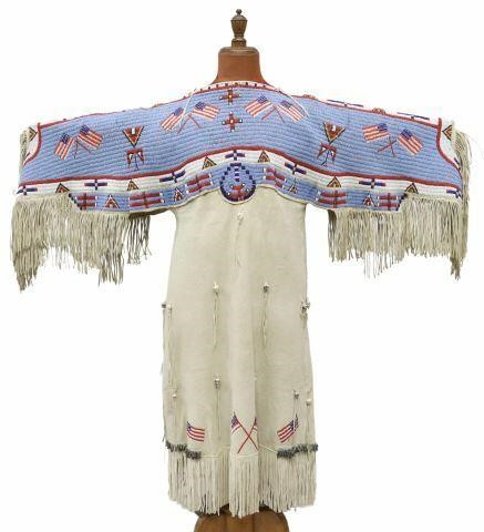 Appraisal: Sioux beaded deer hide fringed pictorial dress c - displaying