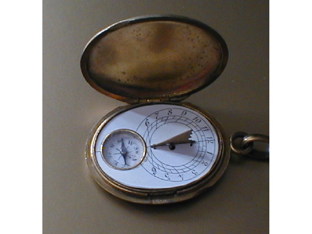 Appraisal: A small oval locket style travelling compass sun dial early