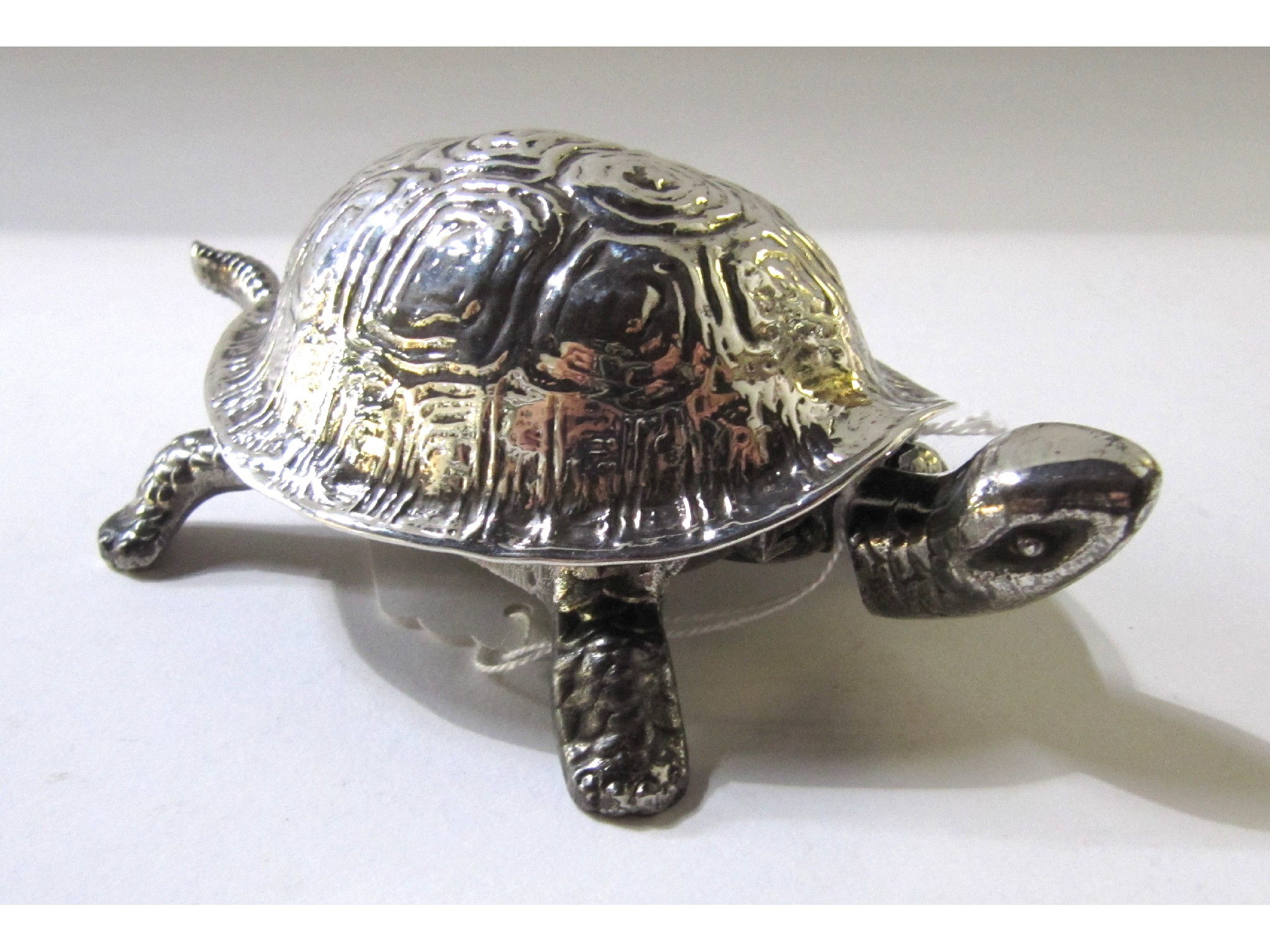 Appraisal: A silver reception bell modelled as a tortoise Chester