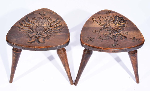 Appraisal: A PAIR OF ELM CARVED TRIANGULAR STOOLS stamped to the