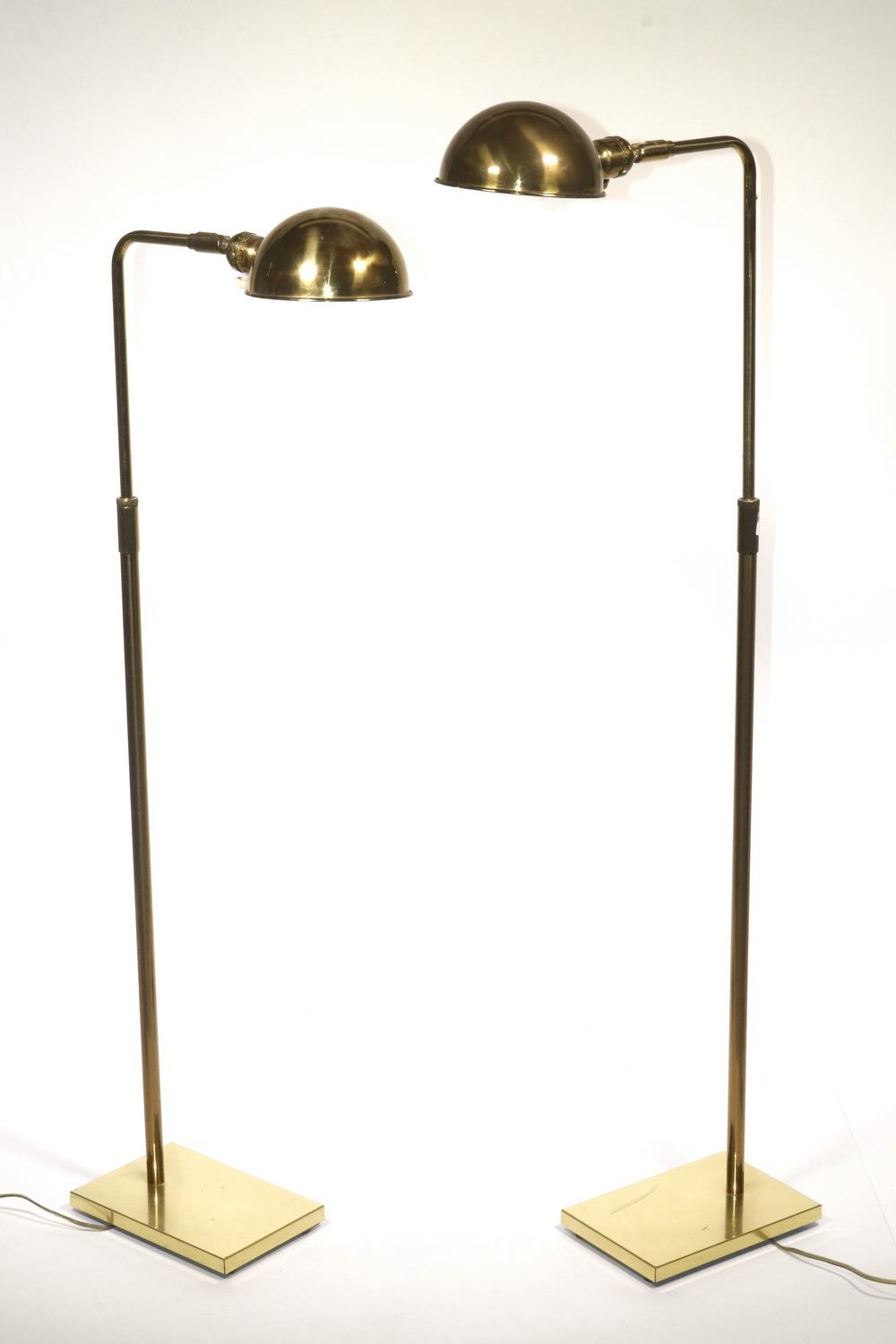 Appraisal: PR OF ADJUSTABLE FLOOR LAMPS Pair of brass adjustable floor