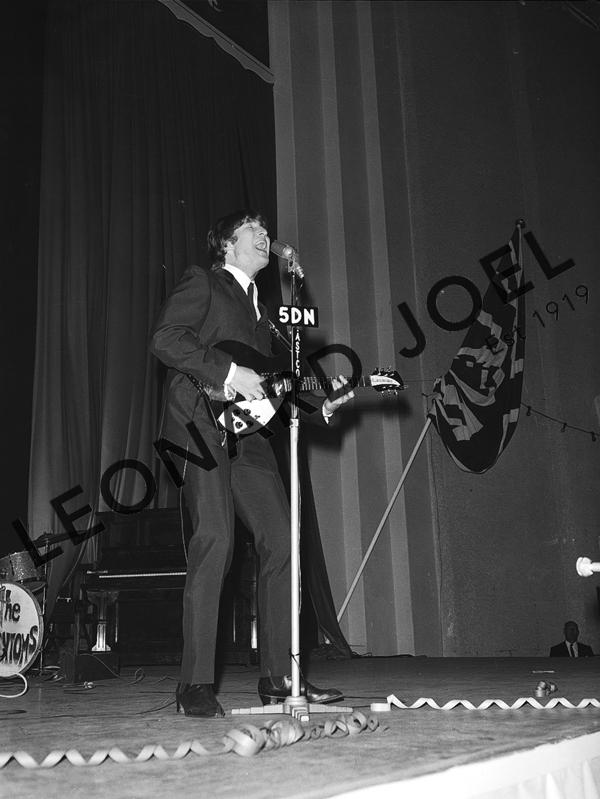 Appraisal: JOHN LENNON PERFORMING ON STAGE