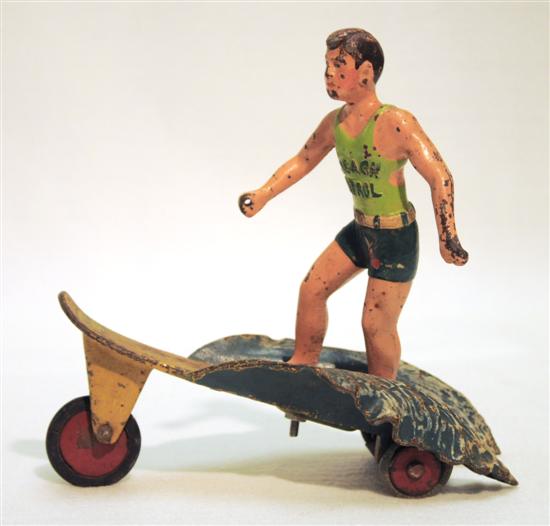 Appraisal: Hubley Surfer Boy pull toy surfer wearing green trunks and