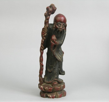 Appraisal: A Carved Chinese Figurine of an Elder Man A tall