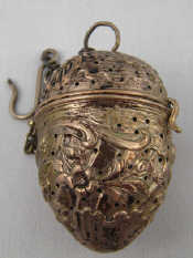 Appraisal: A German standard silver tea infuser on chain with hook