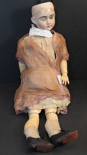 Appraisal: Bisque Doll amp assorted clothing articulating German doll wood body