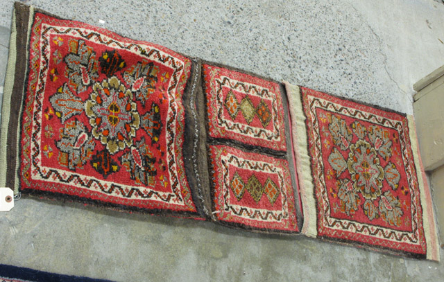 Appraisal: TURKISH YASTIK DOUBLE SADDLE BAG having four hand knotted wool