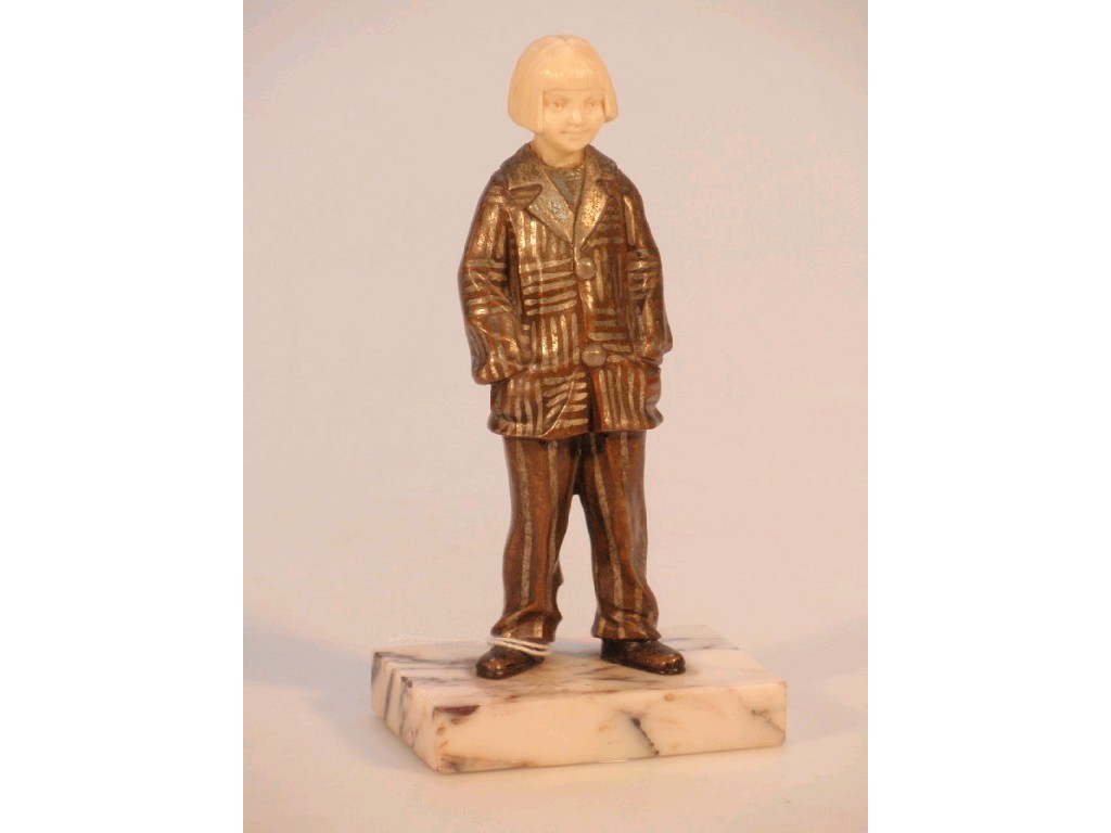 Appraisal: A Priess style figure of a young boy with page