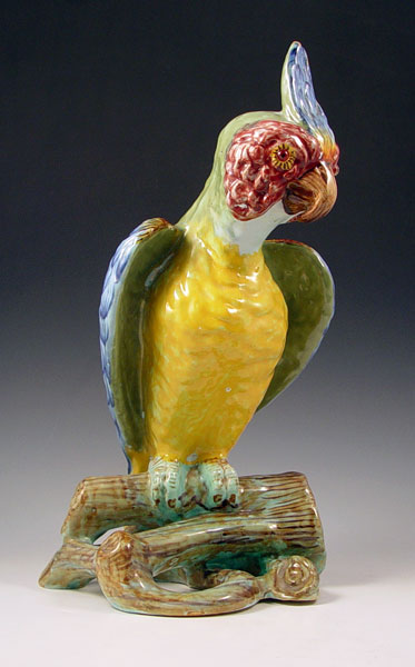 Appraisal: FRENCH MAJOLICA MODEL OF A PARROT With red glass eyes