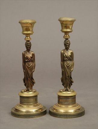 Appraisal: Pair of Neoclassical-Style Patinated and Gilt-Metal Figural Candlesticks in in