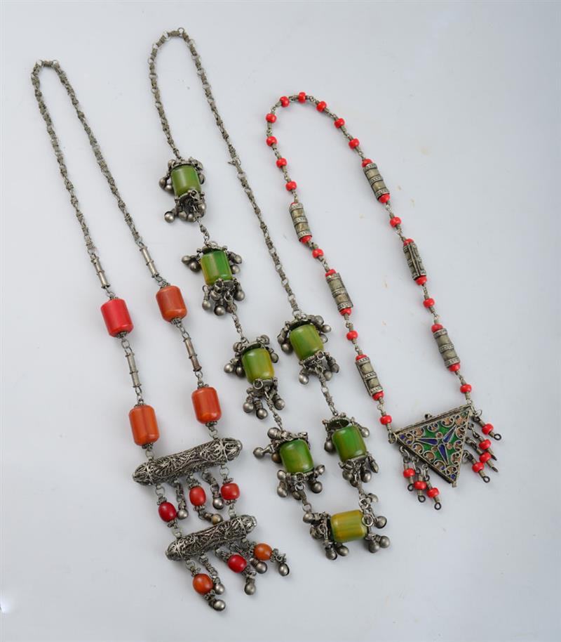 Appraisal: THREE SILVERED METAL AND BEAD NECKLACES One with enamel-mounted triangular