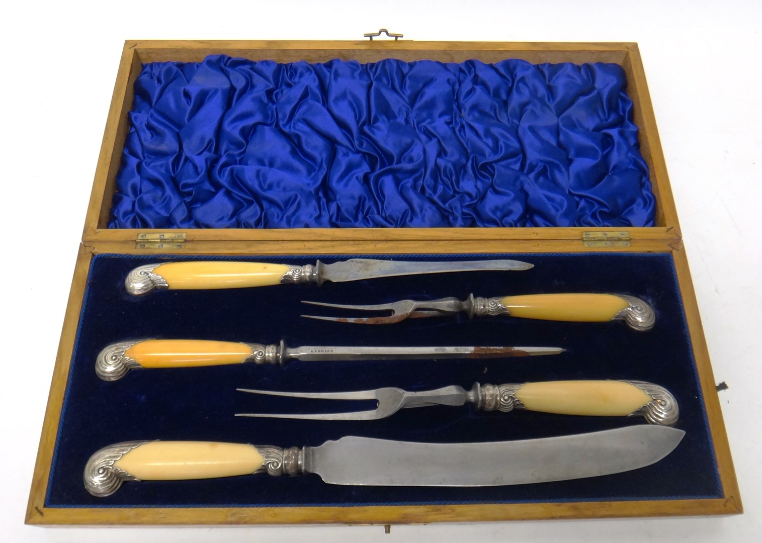 Appraisal: A late Victorian silver mounted five piece carving set comprising