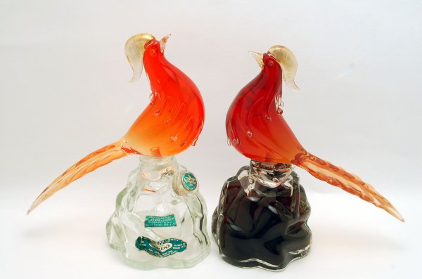 Appraisal: Two Murano glass decanters of birds one red and one