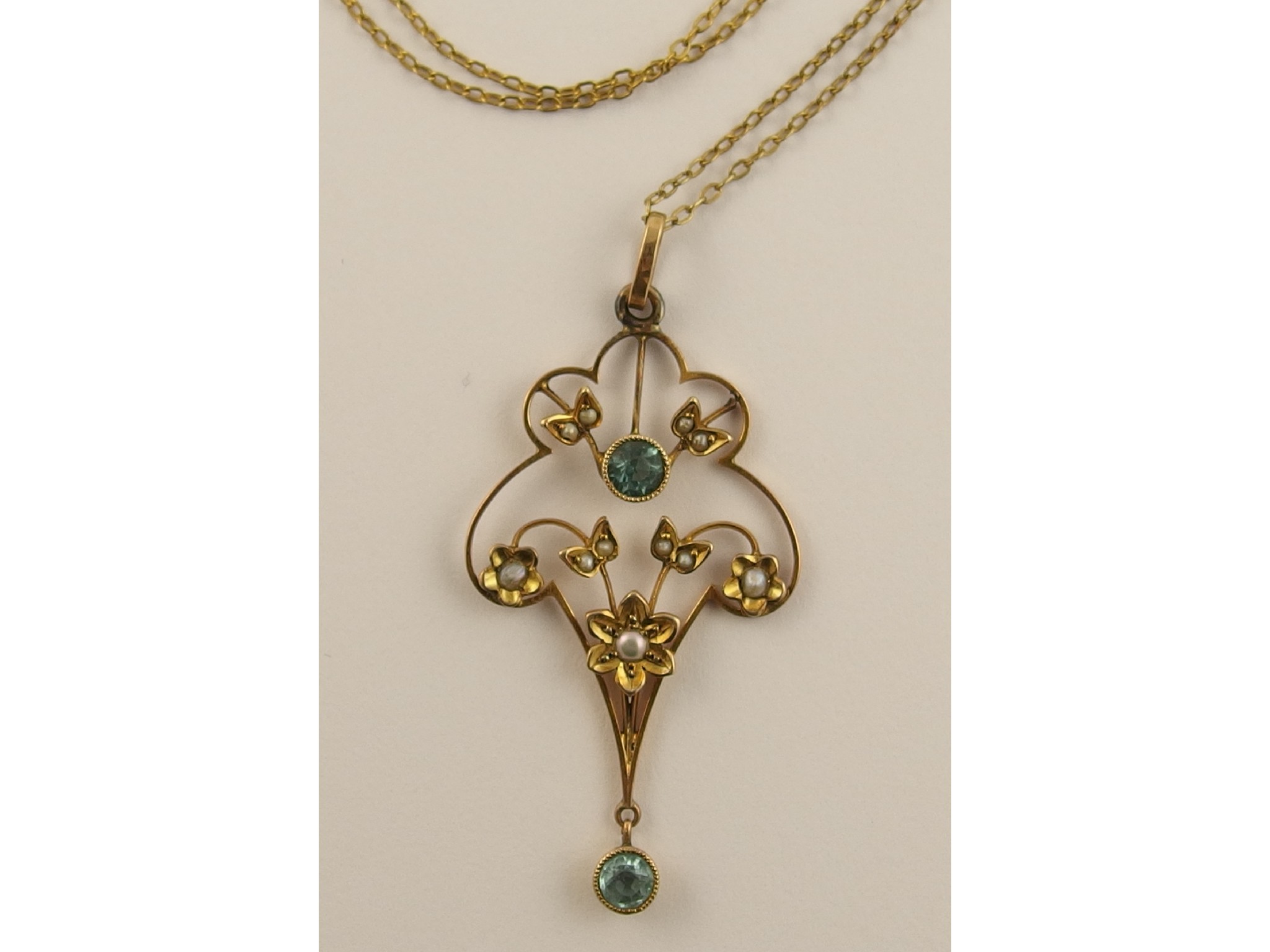 Appraisal: A ct Edwardian pearl and blue gem stone pendant with