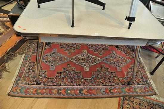 Appraisal: A KILIM IN GREEN RED AND BLUE TONES