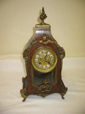 Appraisal: A FRENCH MANTEL CLOCK the eight day movement quarter striking