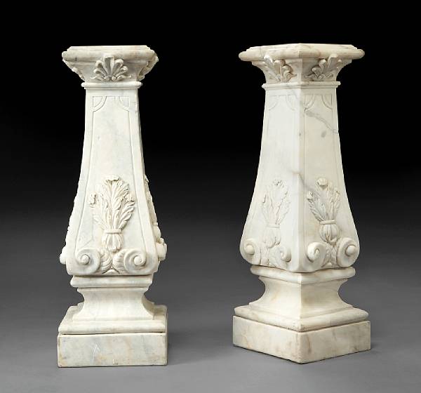 Appraisal: A pair of Neoclassical style carved marble pedestals Each top