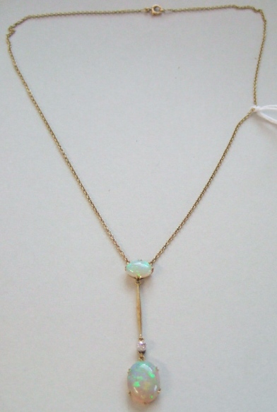 Appraisal: A gold opal and diamond set pendant necklace claw set