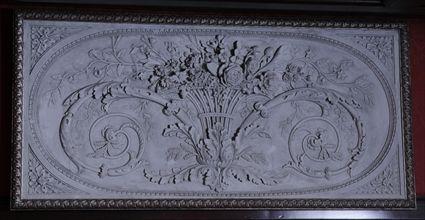 Appraisal: NEOCLASSICAL-STYLE COMPOSITION RELIEF WALL PANEL With flower-filled basket within petal