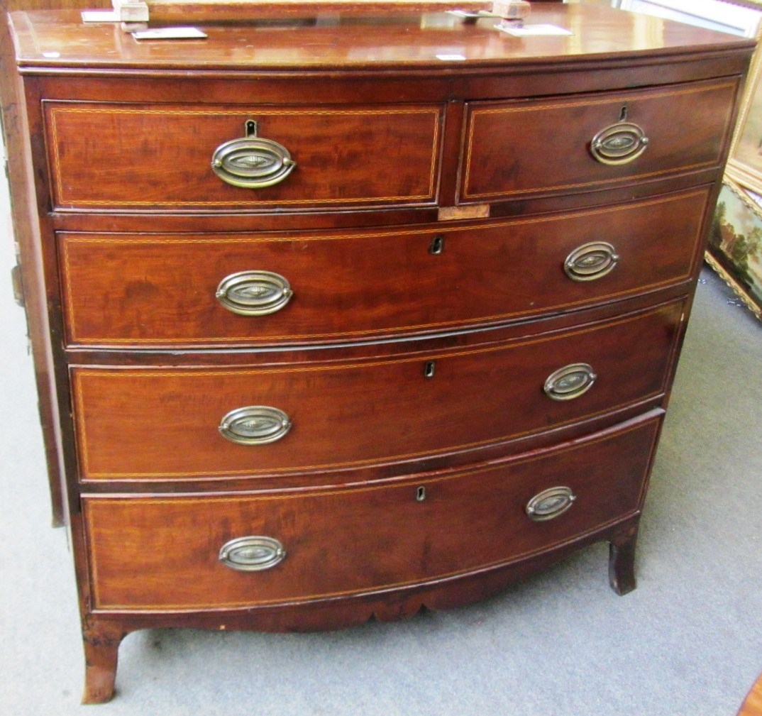 Appraisal: A Regency inlaid mahogany bowfront chest of two short and