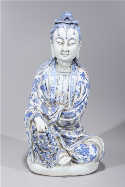 Appraisal: Tall Chinese blue and white porcelain seated figure of Guanyin