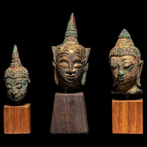 Appraisal: Three Thai Bronze Buddha Heads with Stands Height of tallest