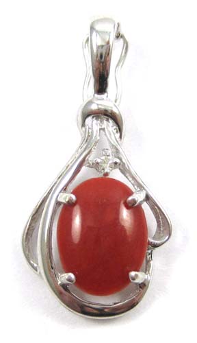 Appraisal: RED CORAL DIAMOND AND WHITE GOLD PENDANT The k gold